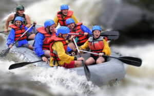 Vacation Lodge Activities | People Rafting in Water
